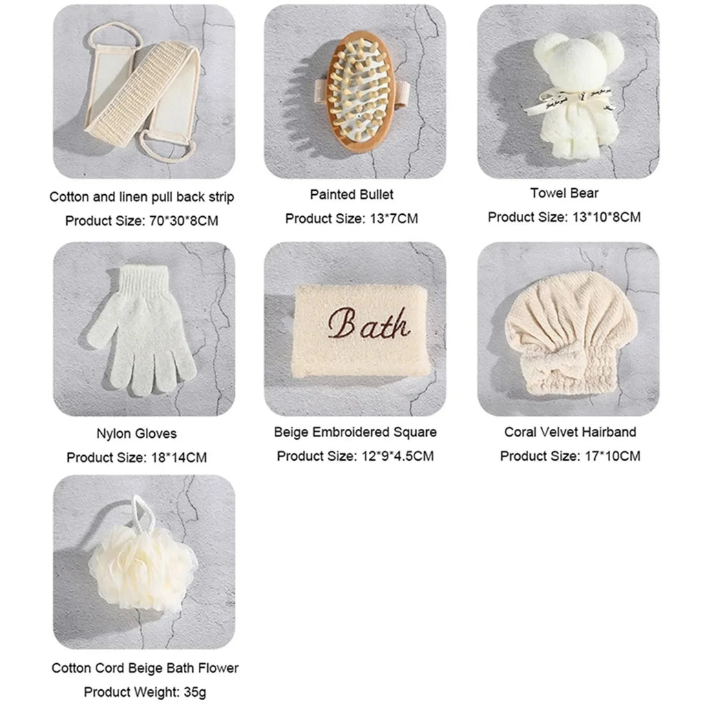 Beige bath accessory set with bath flower, gloves, brush, pull back strip, hairband, towel bear, and embroidered bath sponge on gray background.